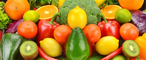 Bright background from vegetables and fruits. Wide photo.