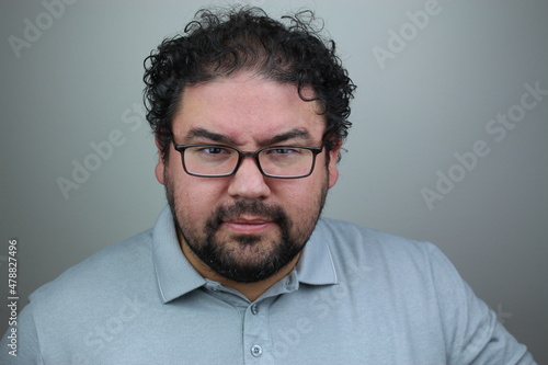 Face of an angry and heated man on a gray background 