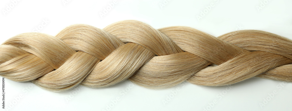 Light female hair on white background, close up Light female hair on white background, close up