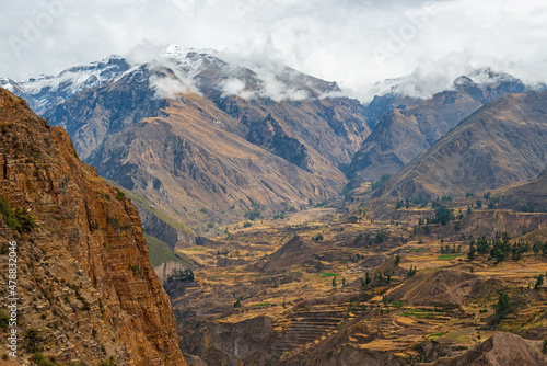 Colca Canyon landscape with snowcapped Andes mountain peaks in autumn, Arequipa, Peru.