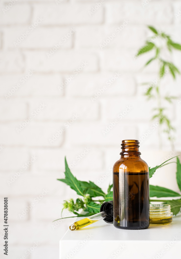 cbd oil and cannabis leaves cosmetics front view cbd oil and cannabis leaves cosmetics front view