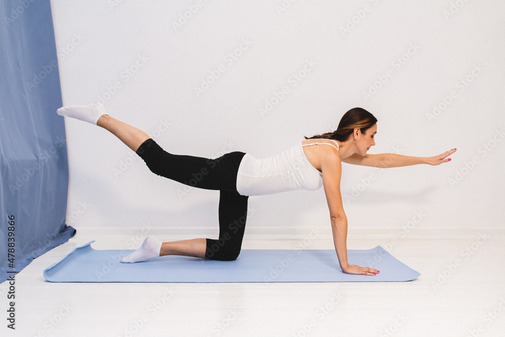 young woman is doing a morning yoga complex.