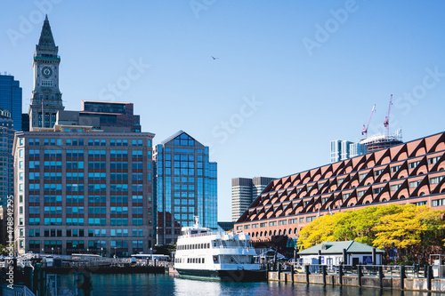 Tela View of Buildings and waterfront with a charter boat docked in Boston Harbor