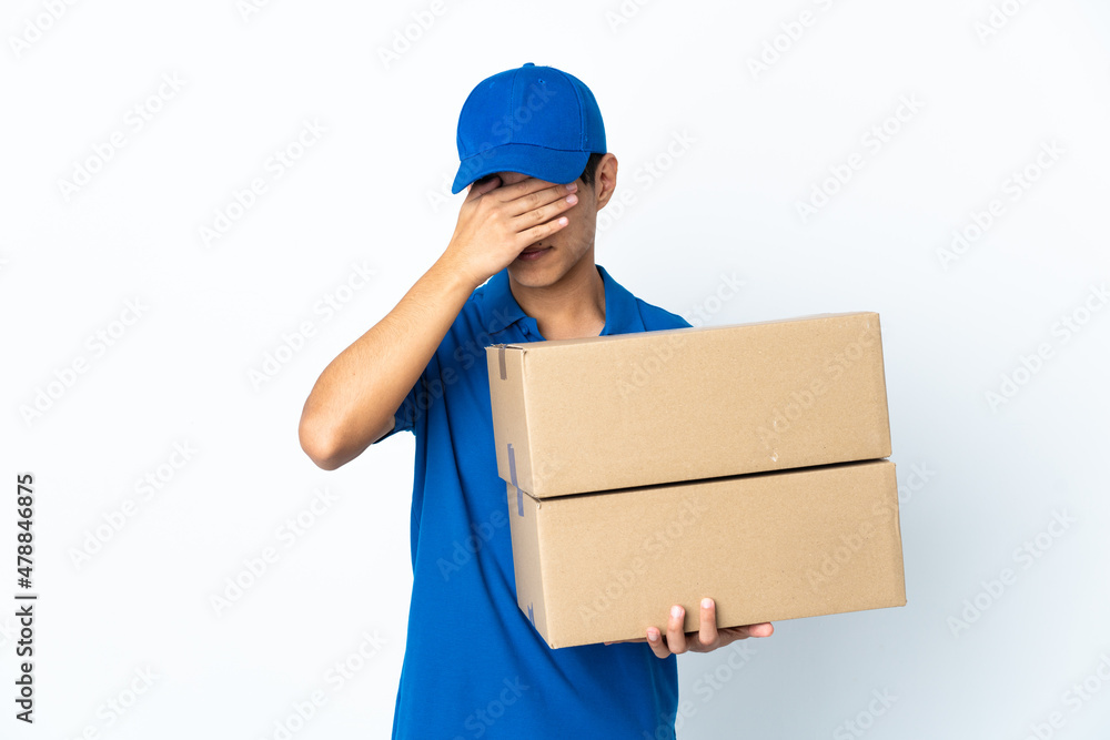 Delivery Chinese man isolated on white background covering eyes by hands Delivery Chinese man isolated on white background covering eyes by hands