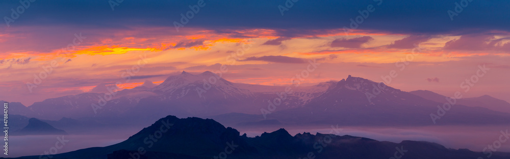 Purple sky over the mountains. Panorama copy space landscape.