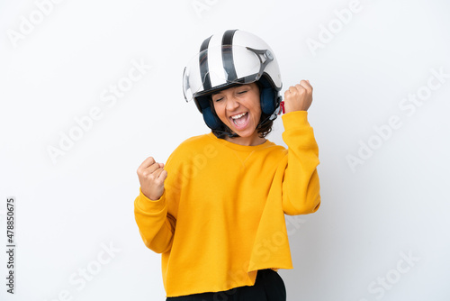 Woman with a motorcycle helmet celebrating a victory