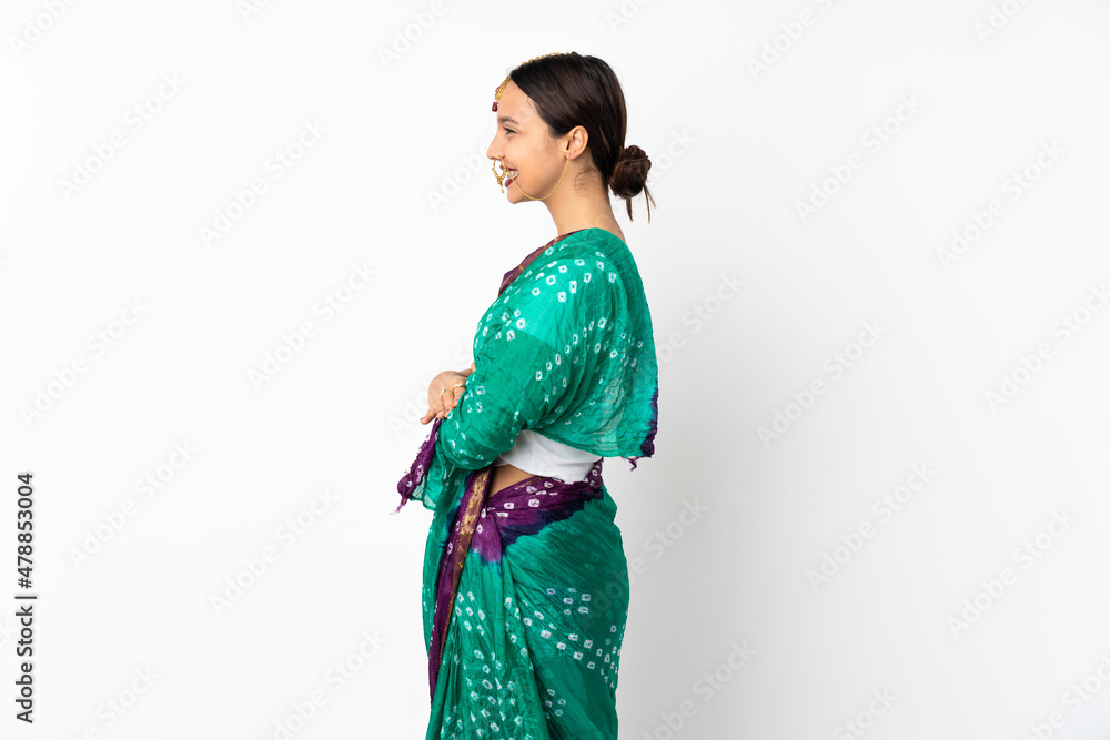 Young indian woman isolated on white background in lateral position Young indian woman isolated on white background in lateral position