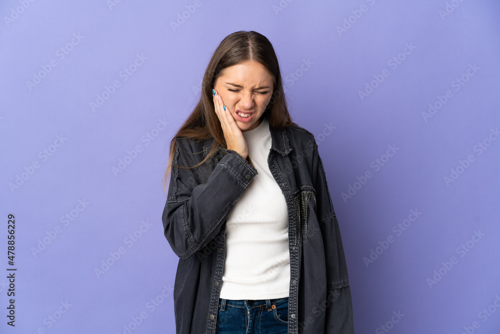 Young Lithuanian woman isolated on purple background with toothache Young Lithuanian woman isolated on purple background with toothache