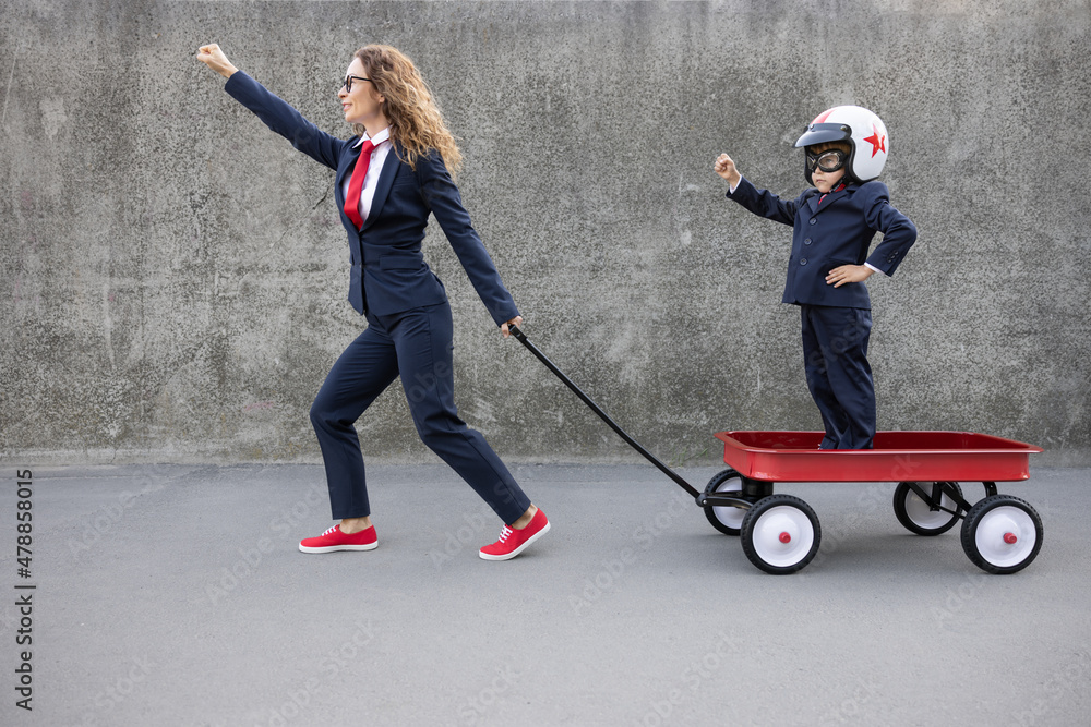 Happy woman and child going to work outdoor Happy woman and child going to work outdoor