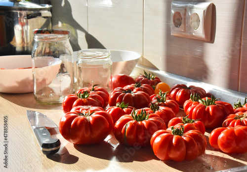 Ripe and red tomatoes in the kitchen