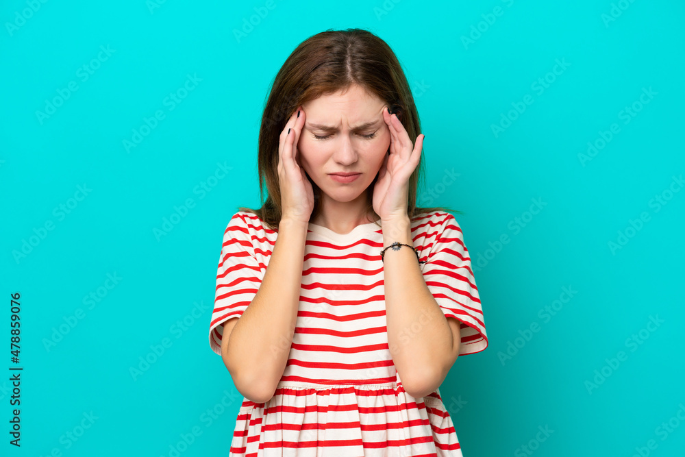 Young English woman isolated on blue background with headache Young English woman isolated on blue background with headache