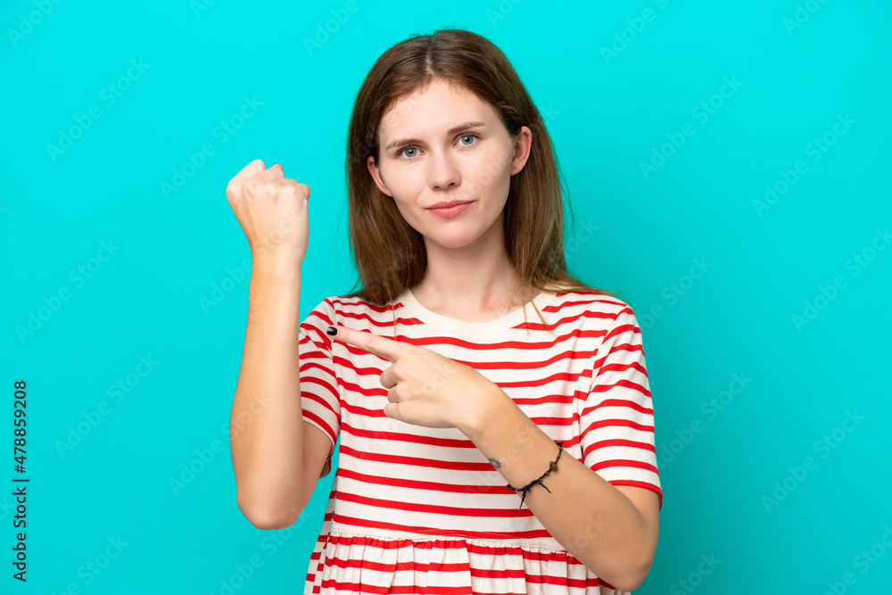 Young English woman isolated on blue background making the gesture of being late Young English woman isolated on blue background making the gesture of being late