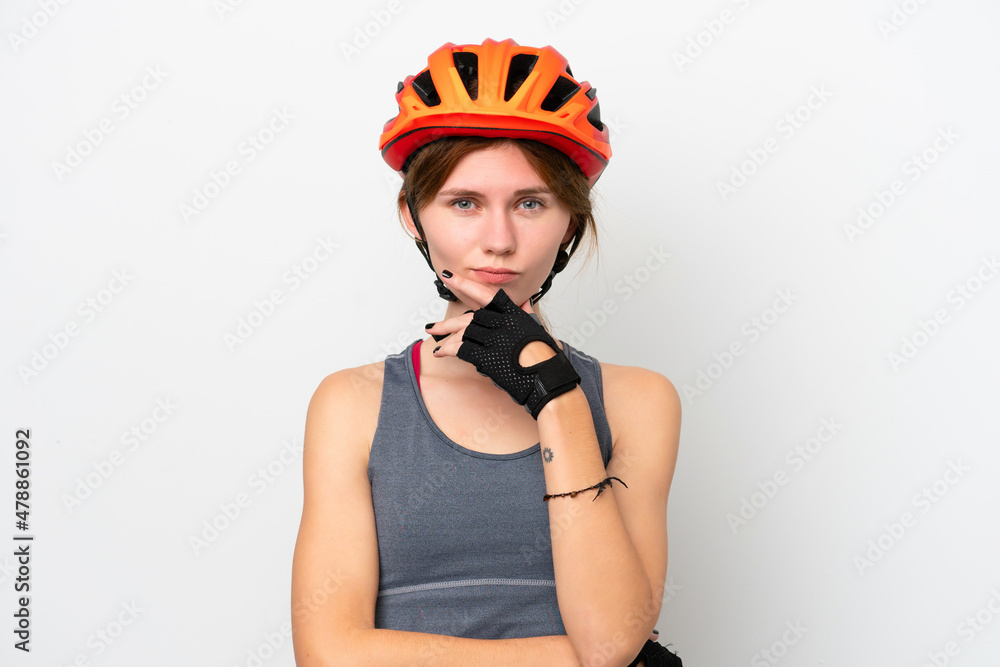 Young cyclist English woman isolated on white background thinking Young cyclist English woman isolated on white background thinking