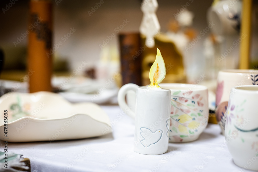 Ceramic handmade candle with flame Ceramic handmade candle with flame
