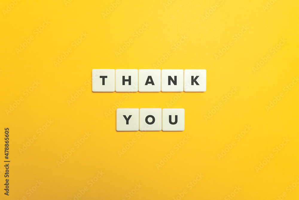 Thank You. Block letter tiles on bright orange background. Thank You. Block letter tiles on bright orange background.