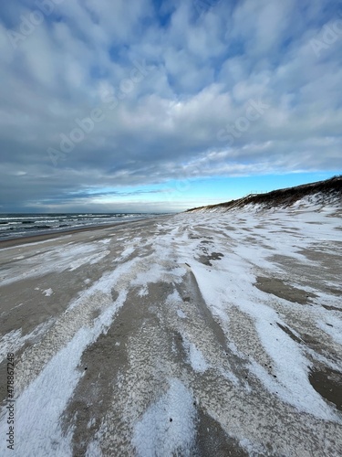 Cold winter day with plenty of snow on the beach