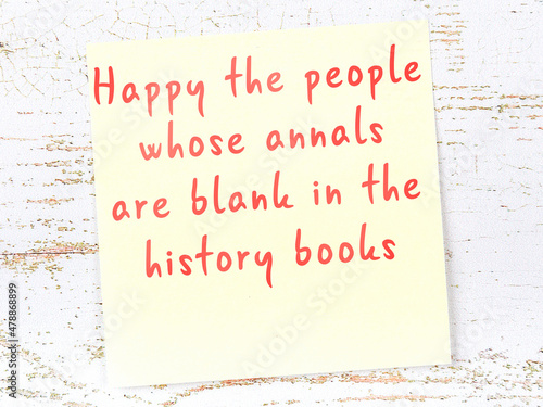 Wise quote on sticky note on wooden wall