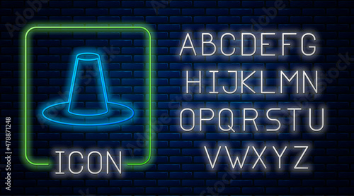 Glowing neon Traditional korean hat icon isolated on brick wall background. Neon light alphabet. Vector