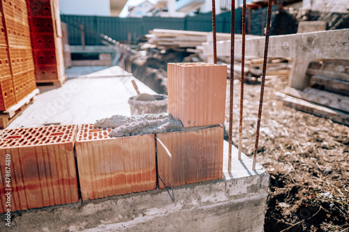 details of construction site with bricks and bricklaying