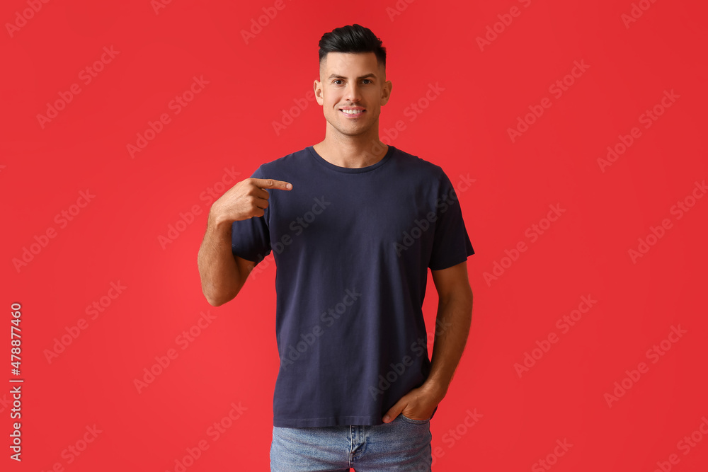 Handsome young man in stylish t-shirt on color background Handsome young man in stylish t-shirt on color background