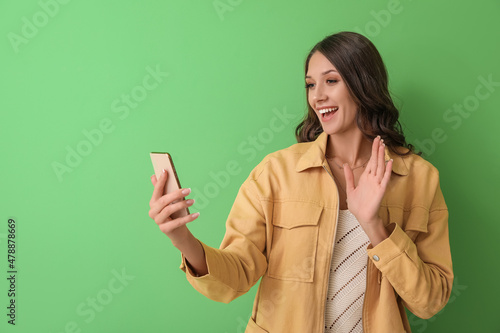 Young woman using mobile ph...