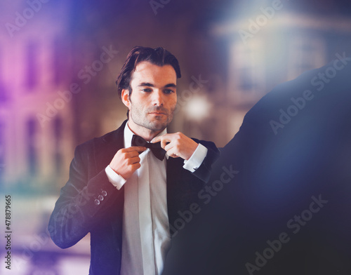 Fototapeta man in tuxedo and bow tie dressing