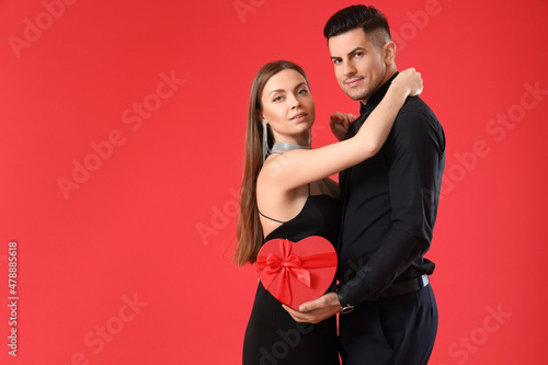 Happy young couple with gif...