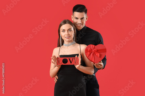 Happy young couple with gif...