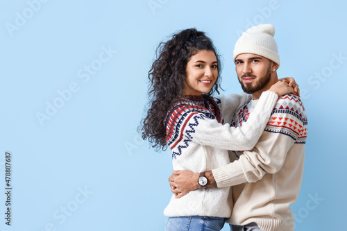 Happy young couple in warm ...