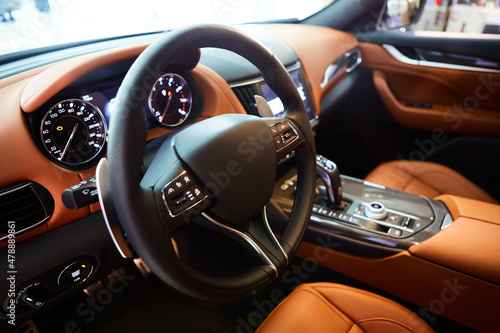 Car inside driver place. Interior of prestige modern car. Steering wheel, dashboard, display. Luxury car interior © sarymsakov.com