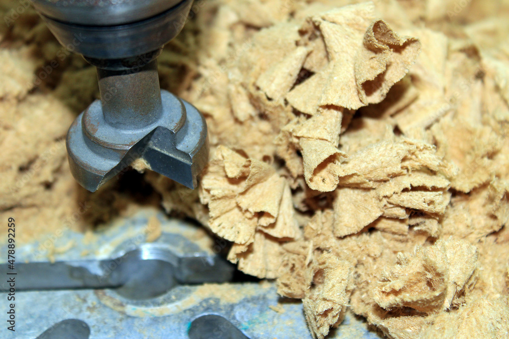 Close-up of a wooden Mill surrounded by chip Close-up of a wooden Mill surrounded by chip