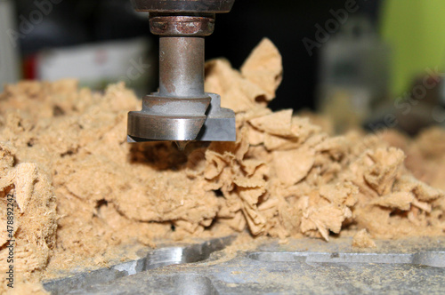 Fototapeta Naklejka Na Ścianę i Meble -  Close-up of a wooden Mill surrounded by chip