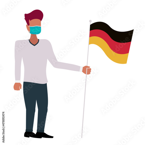 Person with corona face mask holding a flag of Germany