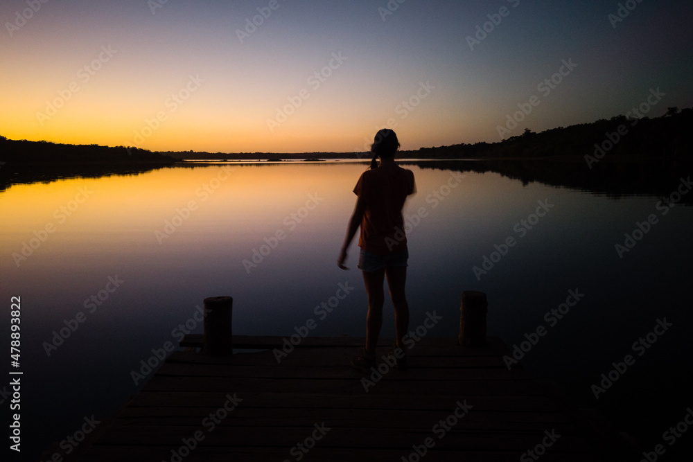 silhouette of a person on a pier silhouette of a person on a pier