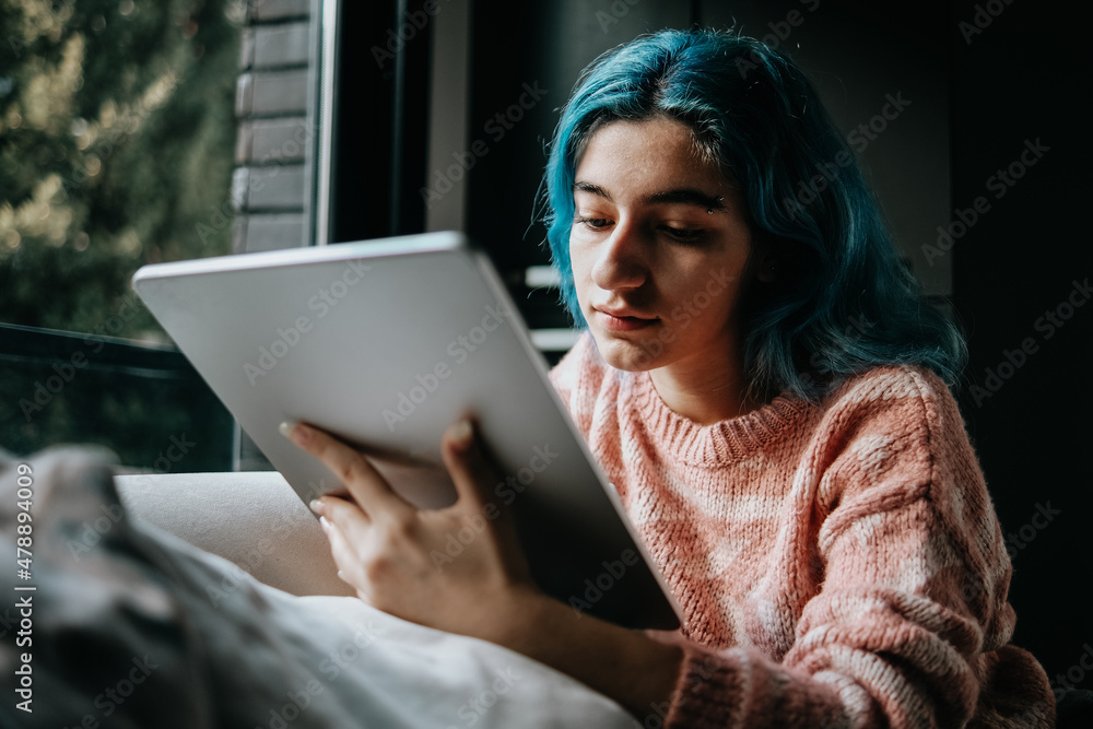 woman using digital drawing tablet at home woman using digital drawing tablet at home