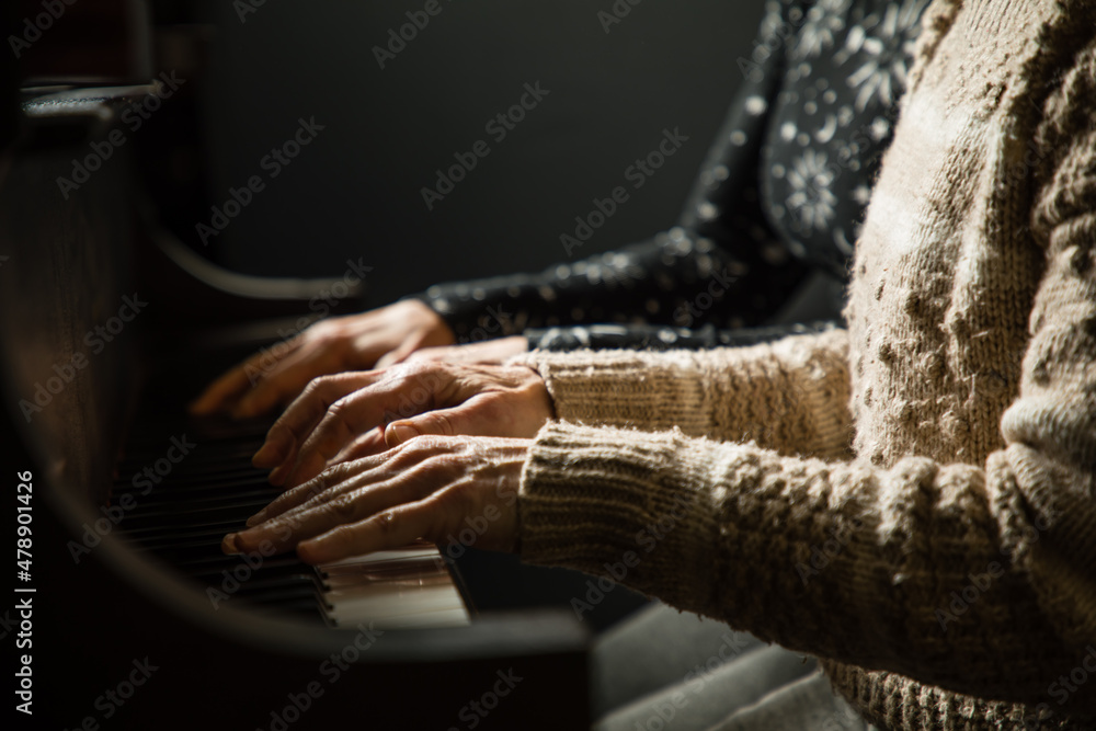 Playing a Piano Duet Stock Photo Adobe Stock