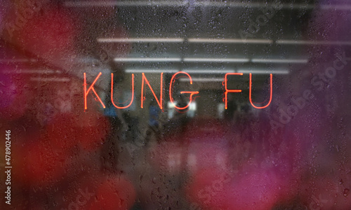 Obraz na plátně Neon Kung Fu Sign in wet window