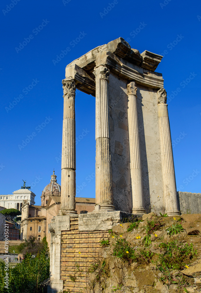 Blue sky above the ruined colonnade in the Roman forum in Rome, Italy