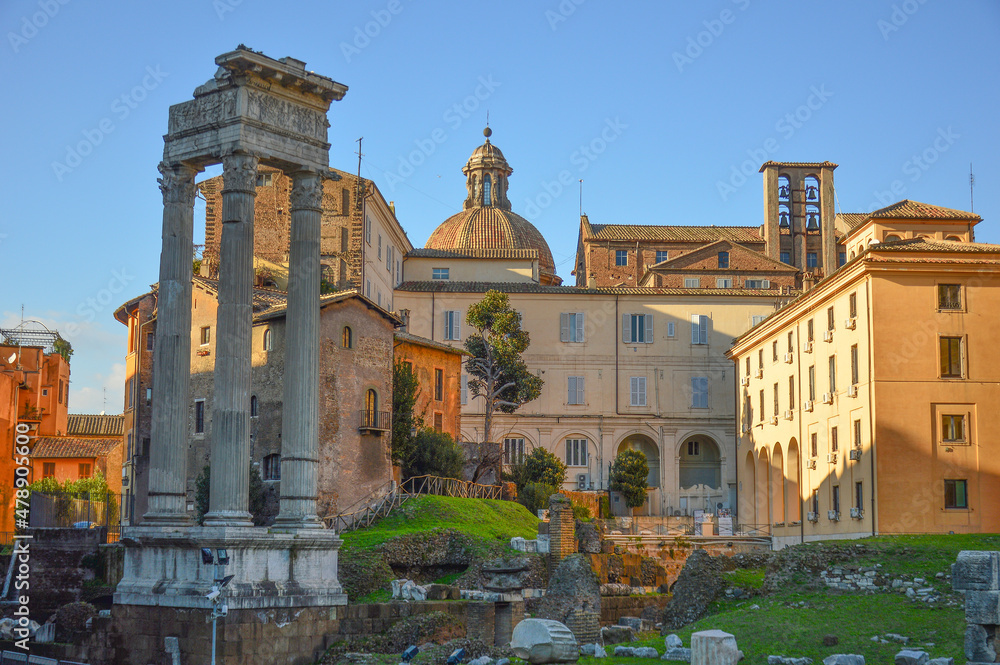 Evening sky above the ruined temple of Apollo Sosianus and the church of Santa Maria in Portico  in Rione Sant'Angelo, Rome, Italy.