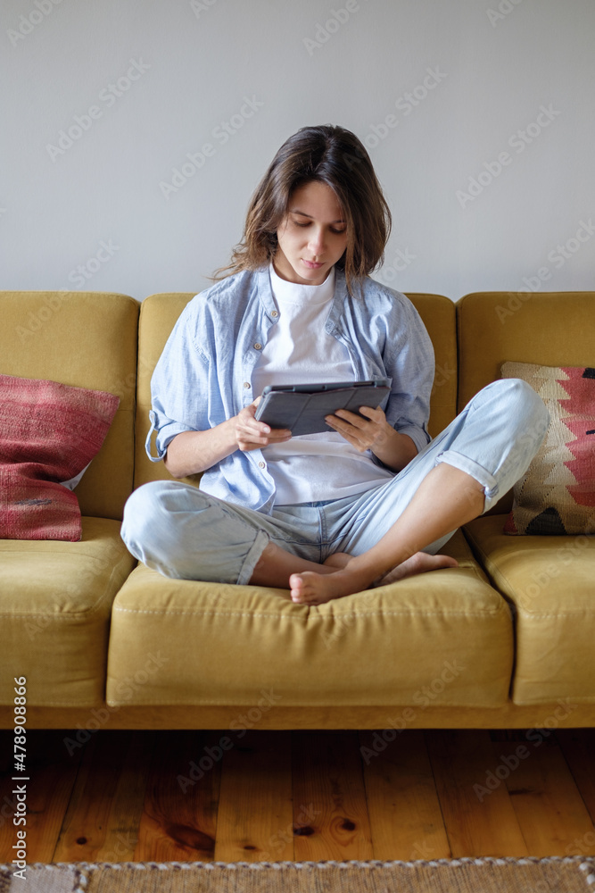 Woman scrolling one at home Woman scrolling one at home