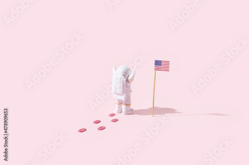 Cosmonaut placing american flag photo