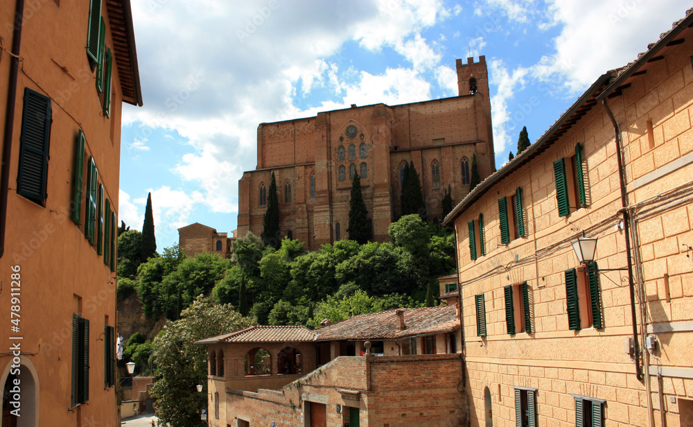 external walls of the monument church of san domenico among the narrow streets of the enchanting medieval siena