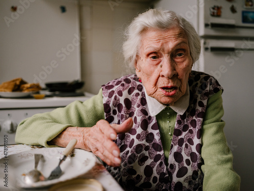 Grandma talking at the kitchen emotional