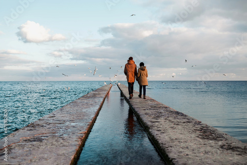 Couple near the sea in winter  photo