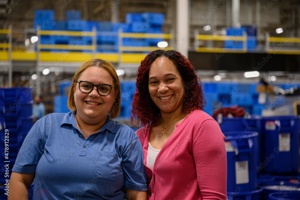 Portrait of Two workers together at warehouse Portrait of Two workers together at warehouse