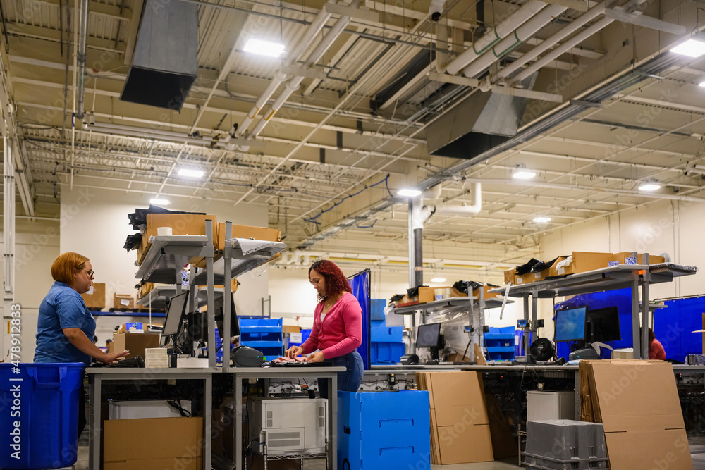 Workers Packing boxes at Logistics warehouse Workers Packing boxes at Logistics warehouse