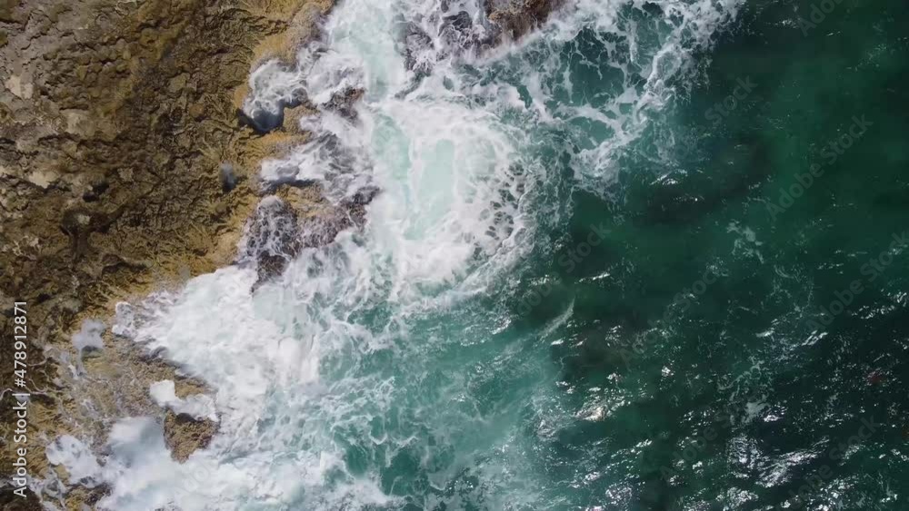 Strong ocean waves beat against the limestone shore of Cozumel Mexico. Static aerial footage captured by drone. Strong ocean waves beat against the limestone shore of Cozumel Mexico. Static aerial footage captured by drone.