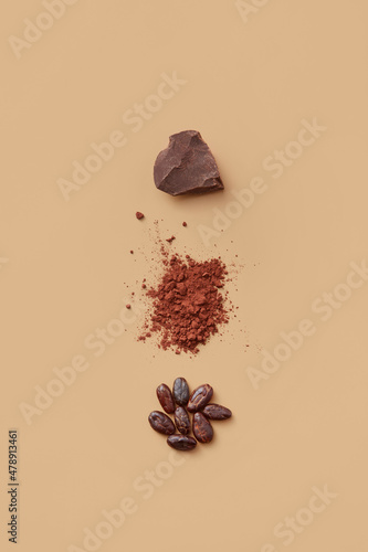 Cocoa beans, powder and chocolate in studio