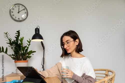 Young woman using tablet at work photo