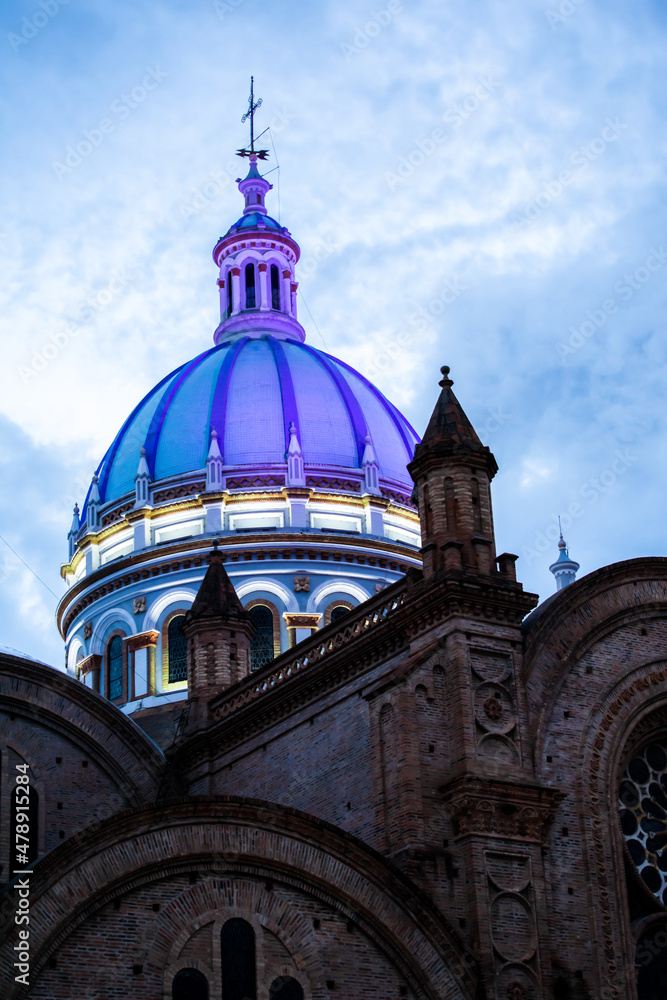 Cathedral of the Immaculate Conception in the historic center Cuenca, Ecuador. Historic church in the evening, beautiful dome with a dramatic sky. Ecuador´s travel destinations. Architectural heritage